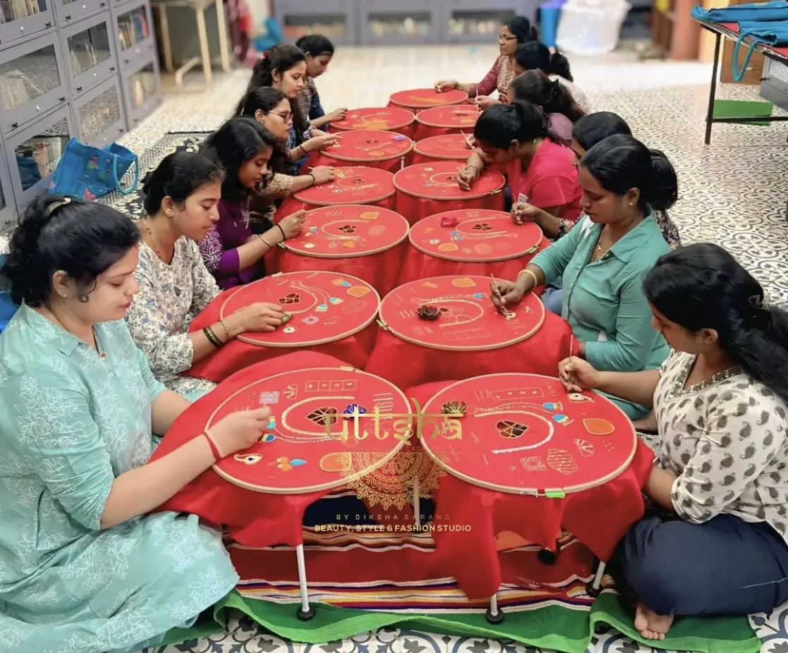 Students practising embroidery at Uttsha Fashion Studio